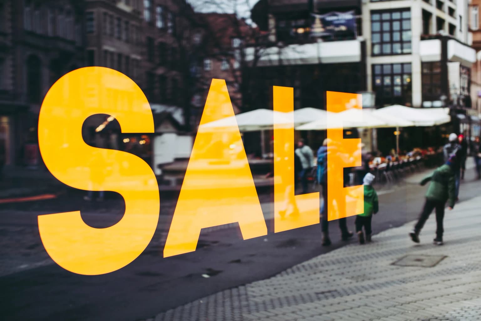 A sale sign in a store window